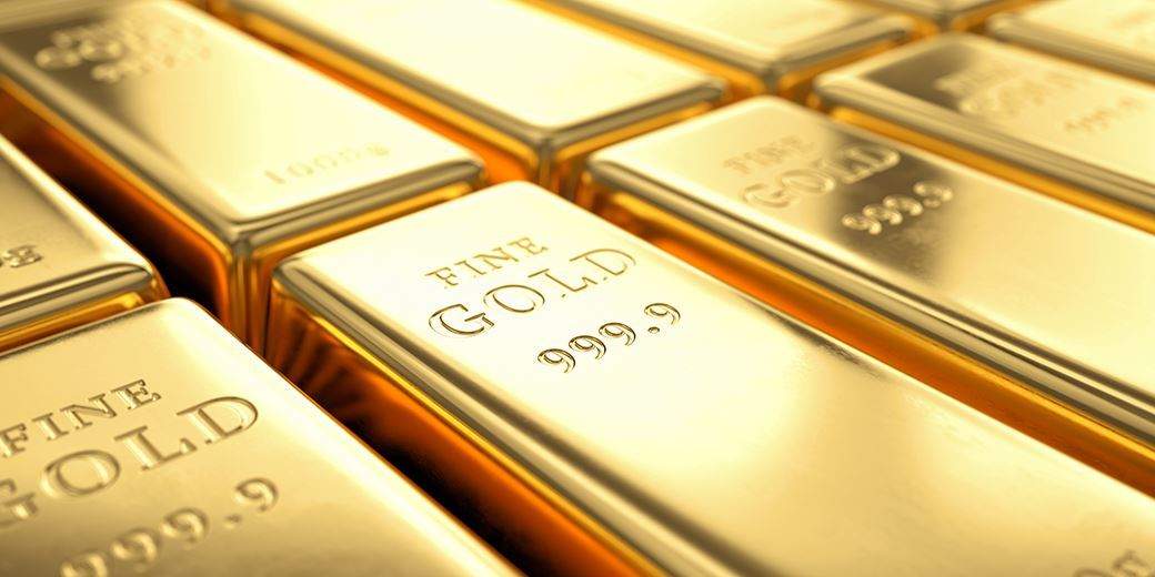 Gold hits 2-week low amid rising U.S. yields, dollar